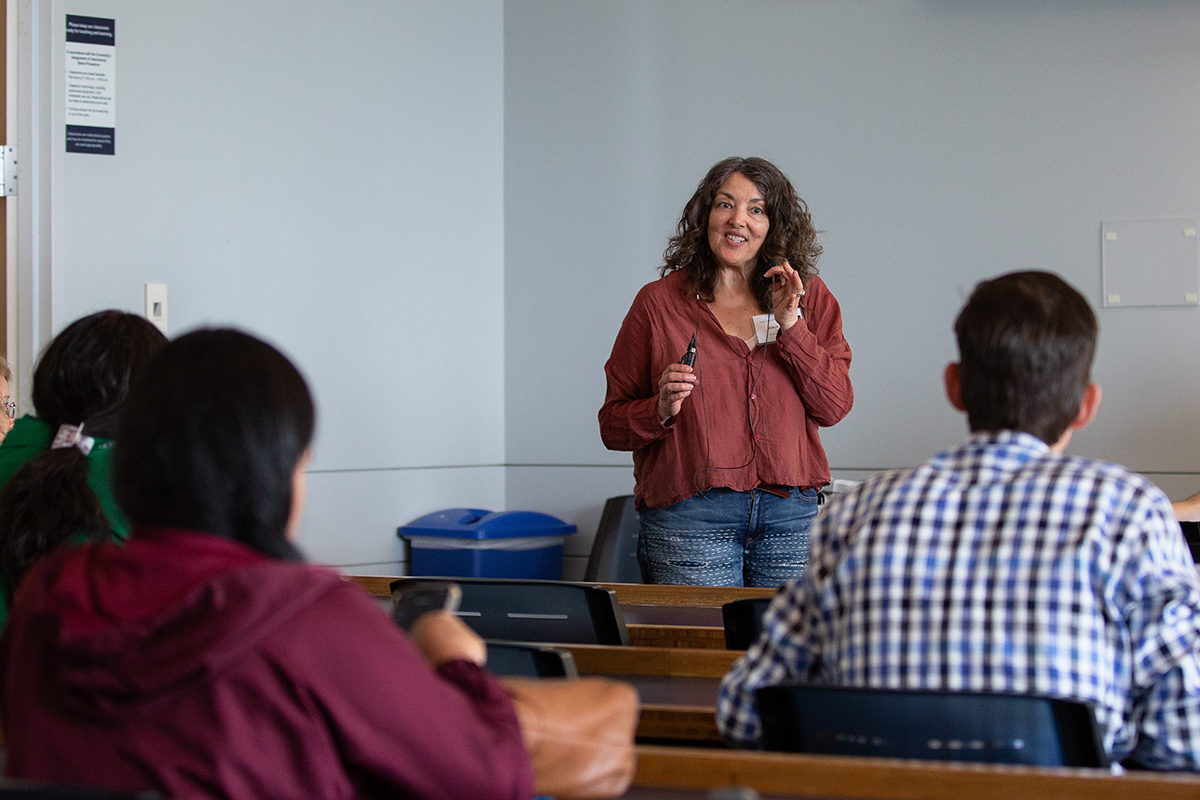 Anji Seth speaks to a group in McHugh Hall.
