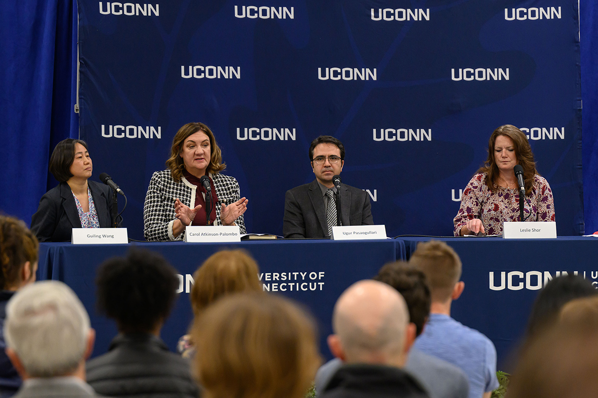 Carol Atkinson-Palombo, professor of geography, speaks at a forum on the world climate.